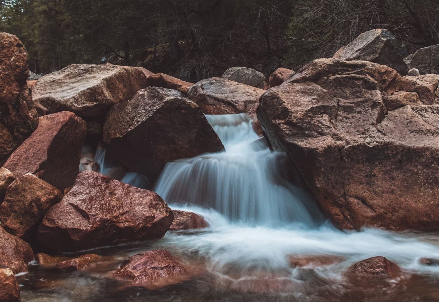 A crystal blue waterfall from a stream